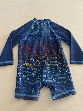 Baby whales swim one piece